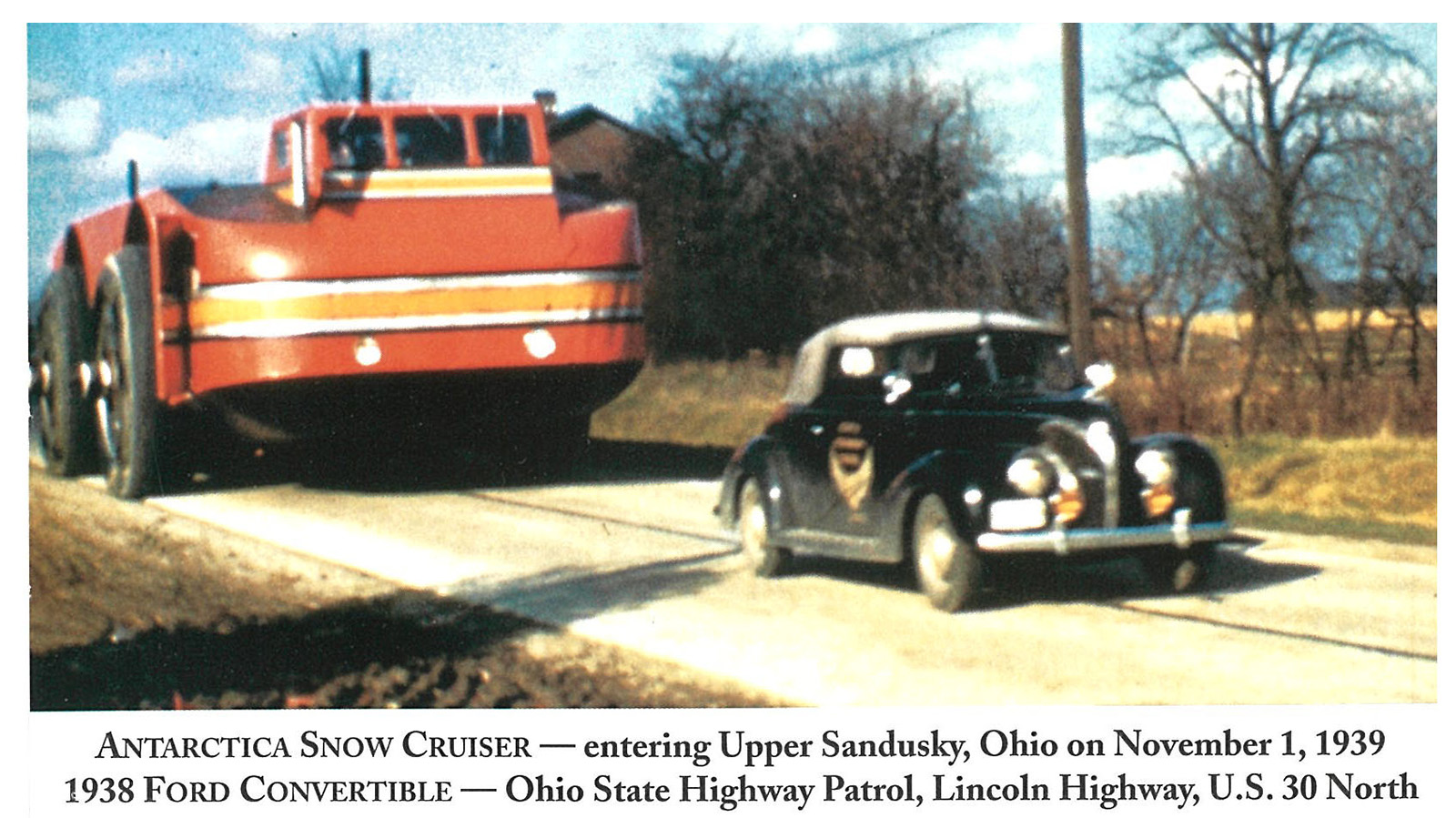 Antarctica Snow Cruiser entering Upper Sandusky, Ohio on November 1, 1939 with Ohio State Highway Patrol car, a 1938 Ford Convertible