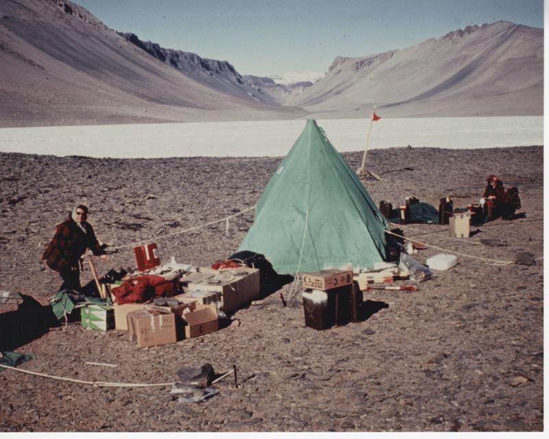 Team members setting up tents and establishing camp in the Dry Valleys of Antarctica