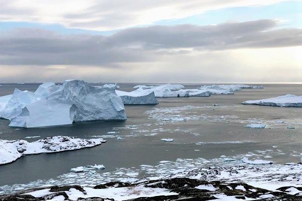 View of ice bergs from rocky outcrop