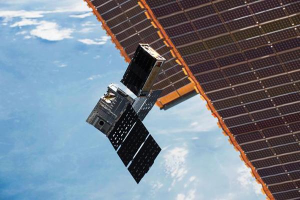 Shoebox-sized CubeRRT satellites being deployed.